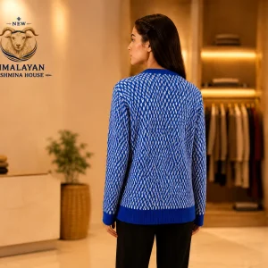 Women wearing Himalayan cashmere sweater – back view showing royal blue argyle knit pattern in luxury showroom