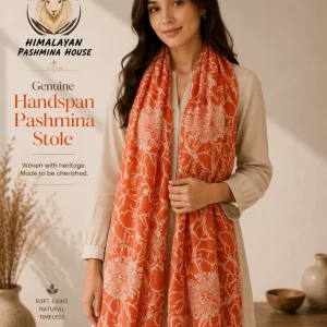 Orange floral handwoven pashmina stole draped elegantly — Himalayan Pashmina House